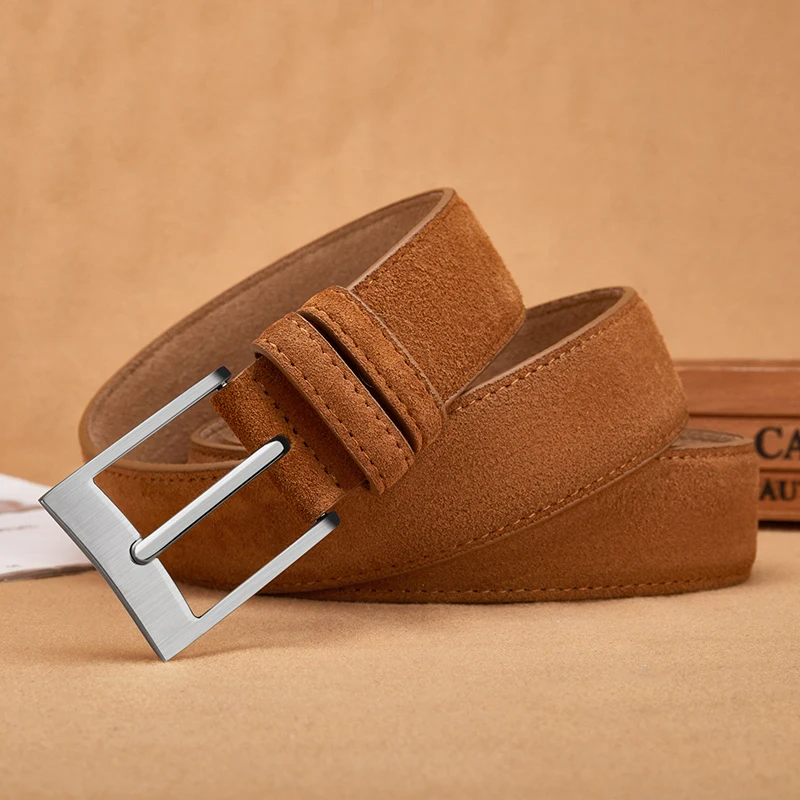 Brown suede belt with a silver buckle on a beige background