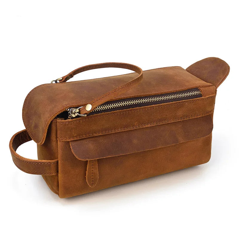 Brown leather bag with a zipper on a white background