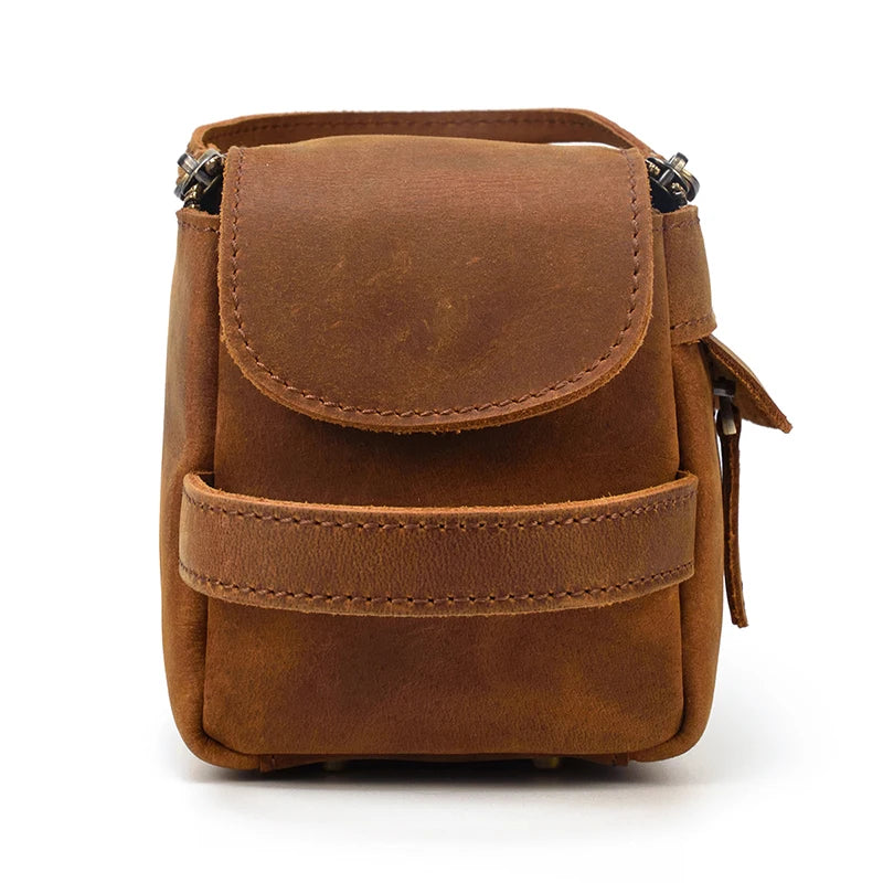 Brown leather pouch with a flap on a white background
