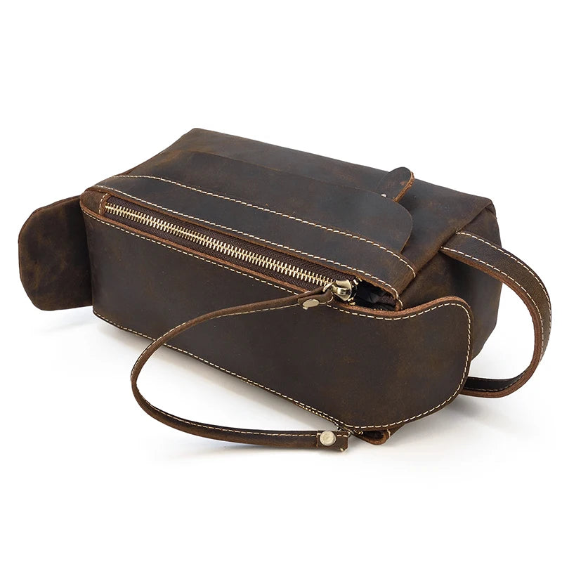 Brown leather bag with a zipper on a white background