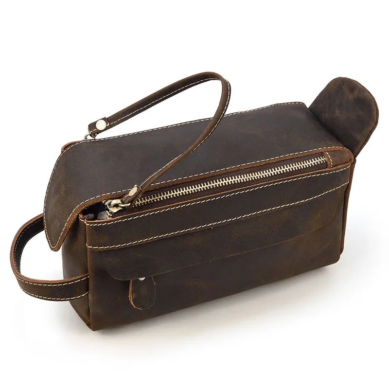 Brown leather bag with a zipper on a white background